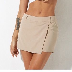 NWT. Motel Rocks wahip mini skirt in soft tailoring beige